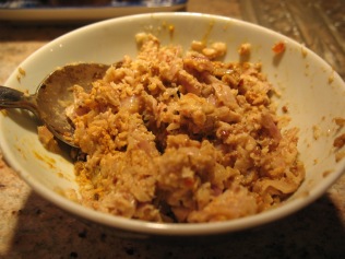 After the paste is pounded (relatively) smooth, mix with tumeric and shrimp paste in a bowl